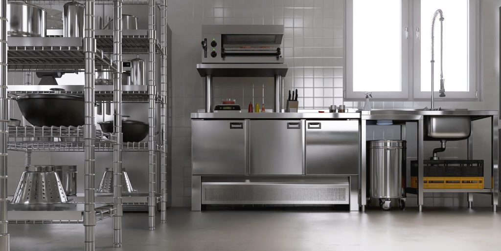 A clean commercial food preparation area with stainless steel equipment and organized kitchen workspaces.