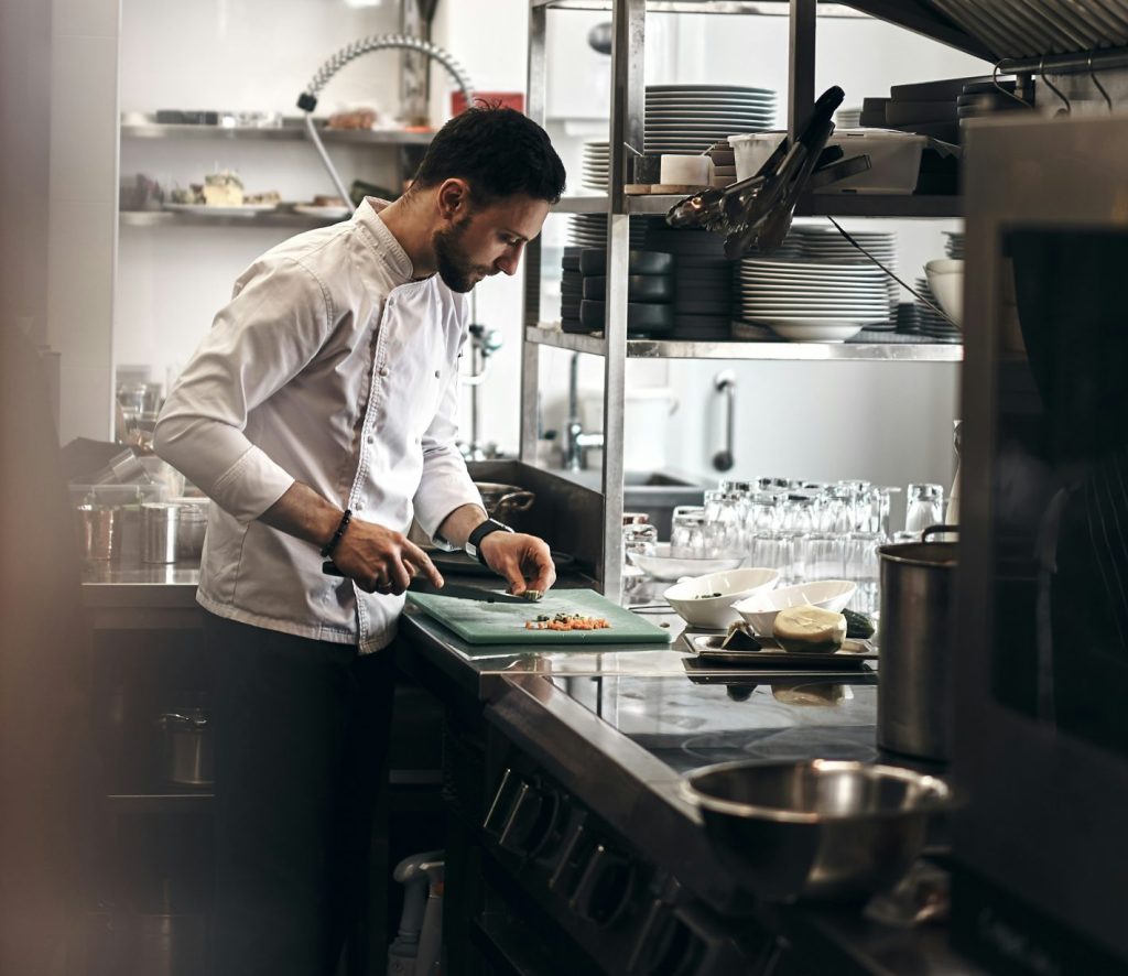 Chef preparing food in a commercial kitchen